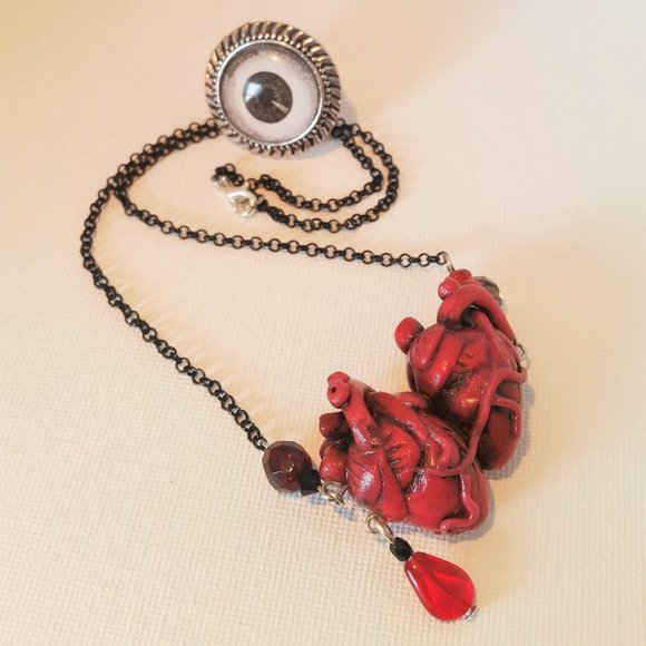Gallitrap Jewelry - HANDMADE Flesh and blood siamese hearts necklace